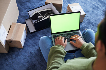 Image showing Online shopping, man with laptop, green screen and package on floor, shoes and delivery service on digital app. Sale, discount and ecommerce on fashion retail website, internet search on computer.