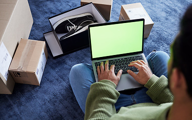 Image showing Ecommerce, man with laptop, green screen and boxes on floor, shoes and delivery service on digital app. Sale, discount and online shopping on fashion retail brand website, internet search on computer