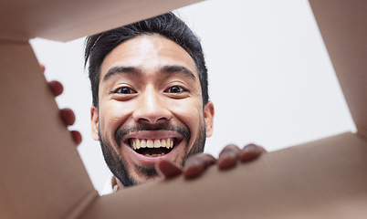 Image showing Surprise, delivery or happy man with box, gift or package with smile or shock for courier service or ecommerce. Face, wow or portrait of person excited by mail post, parcel cargo or shipping present