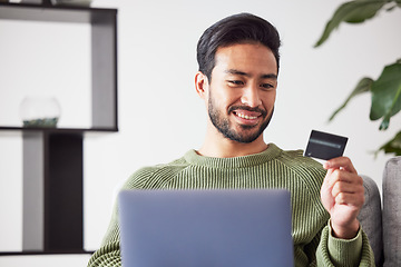 Image showing Laptop, ecommerce or happy man online shopping with credit card for digital product with discount code. Smile, promo or customer with financial payment to buy on sale on fintech application at home