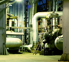 Image showing Pipes, tubes, machinery and steam turbine at a power plant