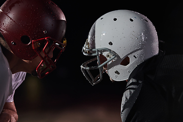 Image showing Two american football players face to face in silhouette shadow on white background