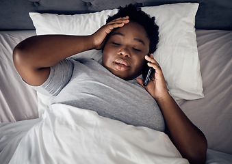 Image showing Insomnia, night and black woman in bed on a phone call talking or speaking of death or problems at home. Stress, upset or sad person in conversation or discussion with mobile communication in bedroom