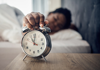 Image showing Wake up, alarm clock or woman sleeping in bed in the morning after resting pressing a snooze button. Sleepy blur, hand or tired person at home getting up from nap in bedroom ready to start a new day