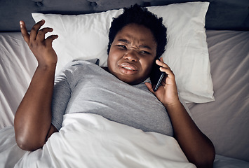 Image showing Confused, above and a black woman on a phone call in bed for communication, conversation or a chat. Frustrated, home and an African girl or person speaking on a mobile in the bedroom in the morning