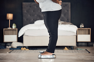 Image showing Legs, scale and weightloss with a person the bedroom of their home for health, fitness or body wellness. Diet, measure and progress with a plus size adult weighing to track the results of a workout