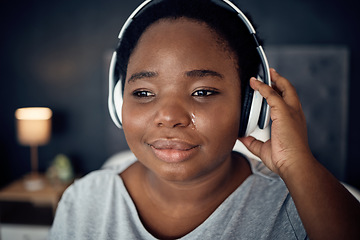 Image showing Crying, sad and black woman with headphones for music, sound or audio. Tears, radio and plus size African person listening, hearing and streaming podcast with depression, crisis and problem in home