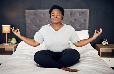 Image showing Yoga, lotus and portrait of black woman on bed for meditation, mindfulness or exercise. Pilates, workout or person in bedroom for zen, relax and plus size body for health, wellness or fitness at home