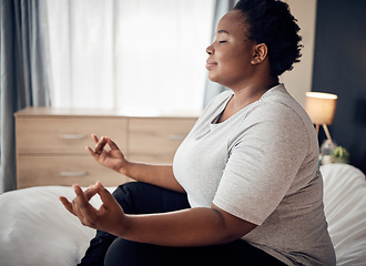 Image showing Yoga, lotus and meditation of black woman on bed for peace, mindfulness or exercise. Pilates, workout and person in bedroom for zen, relax and health of plus size body, wellness and fitness at home