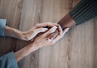 Image showing Holding hands, support and counselling, help and trust with people, top view with psychology and people pray together. Kindness, respect and worship, therapy and wellness with communication and care