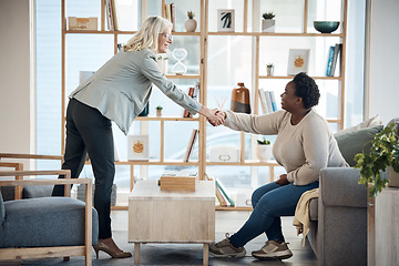 Image showing Women, handshake and meeting for counseling support, thank you and welcome or introduction to therapy. Therapist shaking hands with patient or people for hello, consulting or agreement in psychology