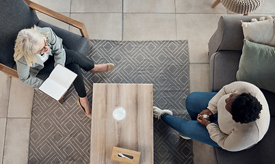 Image showing People, therapy patient and notebook for counseling, psychology evaluation and mental health support or helping. Life coach, therapist or doctor listening to client and women consulting from above