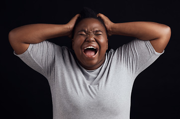 Image showing Anger, frustrated and black woman screaming, depression and mental health on a dark black studio background. Person, emotion and model shouting, anxiety and angry with grief, moody and lose control