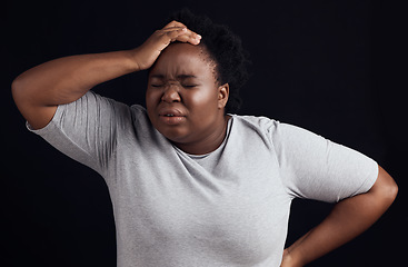 Image showing Frustrated black woman, headache and anxiety in studio of stress, trauma or problem on dark background. Face of confused model in burnout, brain fog or crazy fear of pain, depression or mental health