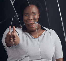Image showing Healing, success and woman portrait with thumbs up in broken mirror after depression and stress in studio. Face, smile and African female abuse survivor emoji hand for feedback on bipolar treatment