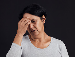 Image showing Frustrated senior woman, headache and anxiety in studio for depression, debt and confused on black background. Face of person with burnout, stress and pain of mental health problem, mistake or crisis