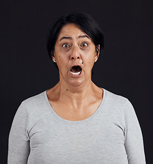 Image showing Portrait, screaming and senior woman with fear, shocked and news with mental health, scared and stress, Face, elderly lady and mature model with emoji, afraid and retirement on dark studio background