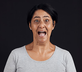 Image showing Anxiety, fear and wow portrait of senior woman in studio with news, drama or secret on blue background. Stress, surprise and elderly lady face with shocked emoji expression for omg, wtf or gossip