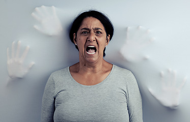 Image showing Portrait, screaming and senior woman with stress, depression and frustrated with mental health or fear. Angry face, female person and model with anxiety, horror and psychology on a studio background