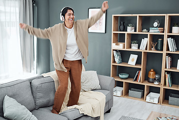 Image showing Headphones, senior or happy woman dancing to music or streaming to relax with freedom at home. Retirement, smile or excited mature person listening to a radio song or audio on an online subscription