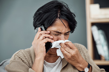 Image showing Phone call, sick and woman blowing her nose for the flu, cold or sinus allergies at her home. Illness, telehealth and senior female person with tissue on a medical doctor consultation with cellphone.