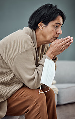 Image showing Sad, thinking and senior woman on sofa with depression or mental health in a home. Covid, anxiety or an elderly sick person on the living room couch with an idea or retirement fatigue in the morning