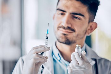 Image showing Man, doctor and syringe with vial for cure, healthcare or medication for injection at the hospital. Male person or medical professional holding needle for dose, diagnosis or drugs at the clinic