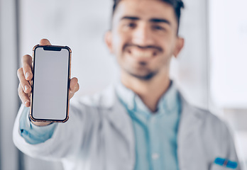 Image showing Happy man, doctor and phone mockup screen for healthcare advertising or marketing at the hospital. Male person or medical professional show mobile smartphone display for Telehealth or app at clinic