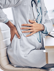 Image showing Man, doctor and hands with back pain from injury, accident or posture sitting on chair at the hospital. Closeup of male person, medical or healthcare employee with sore spine, ache or cramp at clinic