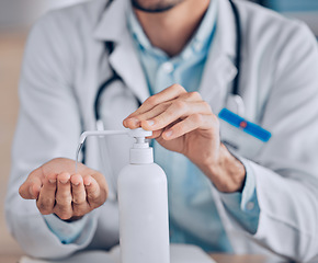 Image showing Man, doctor and hands with sanitizer for hygiene, germ and bacterial removal at hospital. Closeup of male person, medical or healthcare professional cleaning for disinfection or protection at clinic