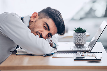 Image showing Man, doctor and sleeping on desk in burnout, overworked or stress from insomnia at the hospital. Exhausted male person, medical or healthcare employee resting or asleep on the office table at clinic