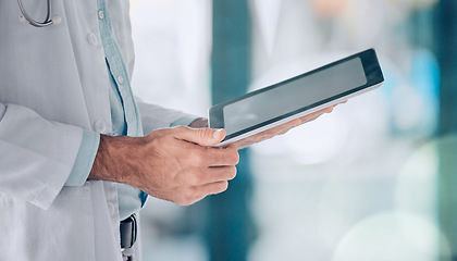 Image showing Digital tablet, hands and man doctor in hospital typing, planning and online consulting on blurred background. Clinic, schedule and male heath expert on app for telehealth, help or research advice