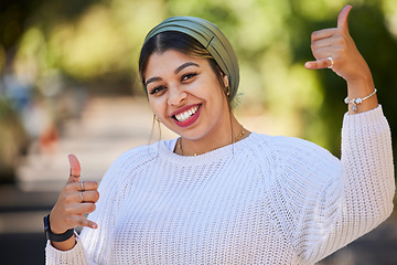 Image showing Muslim, thumbs up and portrait of woman student with yes, agreement and okay gesture on university or college campus. Smile, happy and young female person with thank you sign or symbol in a park