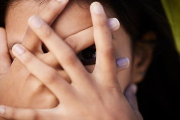 Image showing Woman, eye and face cover closeup with hiding and secret in nature with female person. Model, hands and covering portrait with wellness, anonymous and people outdoor feeling scared and shy from fear