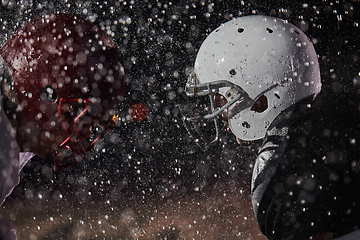 Image showing Two american football players face to face in silhouette shadow on white background