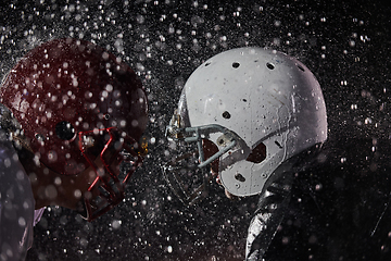 Image showing Two american football players face to face in silhouette shadow on white background