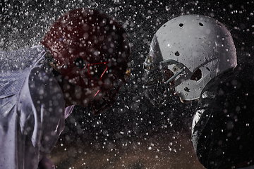 Image showing Two american football players face to face in silhouette shadow on white background