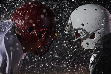 Image showing Two american football players face to face in silhouette shadow on white background