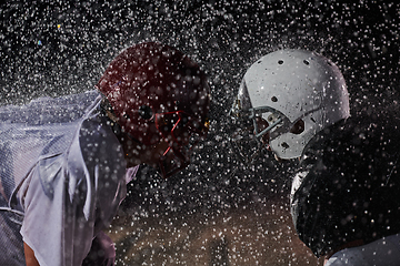 Image showing Two american football players face to face in silhouette shadow on white background