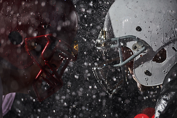 Image showing Two american football players face to face in silhouette shadow on white background