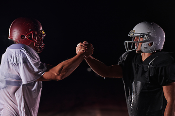 Image showing Two american football players face to face in silhouette shadow on white background