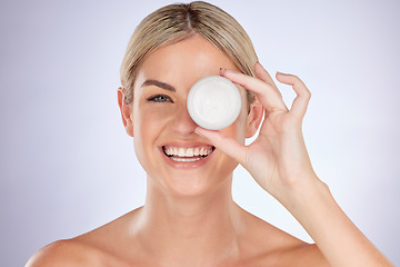 Image showing Skincare, studio portrait and happy woman with cream container for facial hydration, beauty care or collagen glow. Face lotion, cosmetics and person with acne prevention product on purple background