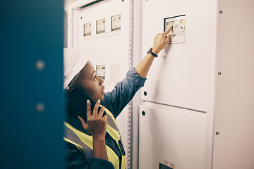 Image showing Black woman, electrical technician or phone call in control room for engineering system, electricity or maintenance service. Female electrician talking on mobile tech, check industrial board or power