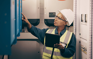 Image showing Engineering, black woman or electrician on tablet for maintenance, server or machine board system. Female technician, digital technology or electrical mechanic in control room at industrial power box