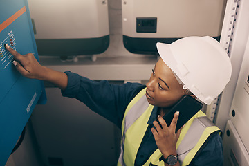 Image showing Black woman, engineering technician and phone call in control room to connect system, generator and machine maintenance. Female electrician talking on mobile tech, check power and electrical inverter