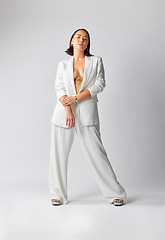 Image showing Fashion, confidence and portrait of woman with suit for classy, sexy and fancy style in studio. Luxury, beautiful and full body of Asian female model with elegant outfit isolated by white background.