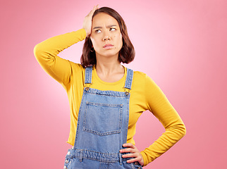 Image showing Confused, thinking and asian woman in studio with questions, problem or choice on pink background. Doubt, decision and and Japanese female with why, emoji or frustrated by news, promo or wondering