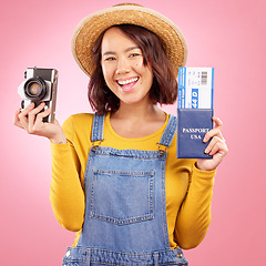 Image showing Tourist woman, camera and passport in studio portrait for travel, photography or excited by pink background. Gen z student girl, airplane ticket or identity documents for compliance with vintage tech