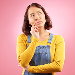 Image showing Asian woman, thinking face and ideas in studio, pink background and vision of mindset, planning and questions. Female model, focus and daydream of decision, remember memory and brainstorming solution