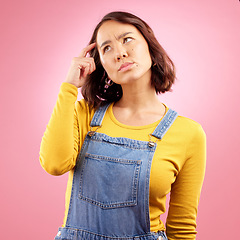 Image showing Confused woman, thinking and scratch for ideas in studio, pink background and emoji for doubt, why and problem solving. Asian model daydream of decision, remember memory and brainstorming questions